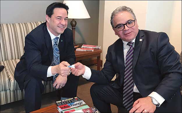 CHBA CEO Kevin Lee presents Liberal Housing Affordability Caucus Chair Francesco Sorbara (MP for Vaughan-Woodbridge) with CHBA's "key" to Unlocking the Door to Homeownership.