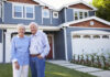 Building for the 60-plus market: The key to unlocking the housing ladder Portrait Of Senior Couple Standing Outside House