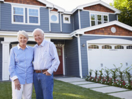 Building for the 60-plus market: The key to unlocking the housing ladder Portrait Of Senior Couple Standing Outside House